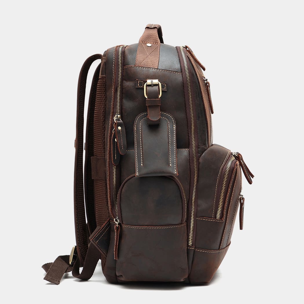 Side profile of handcrafted leather travel backpack with expandable storage
