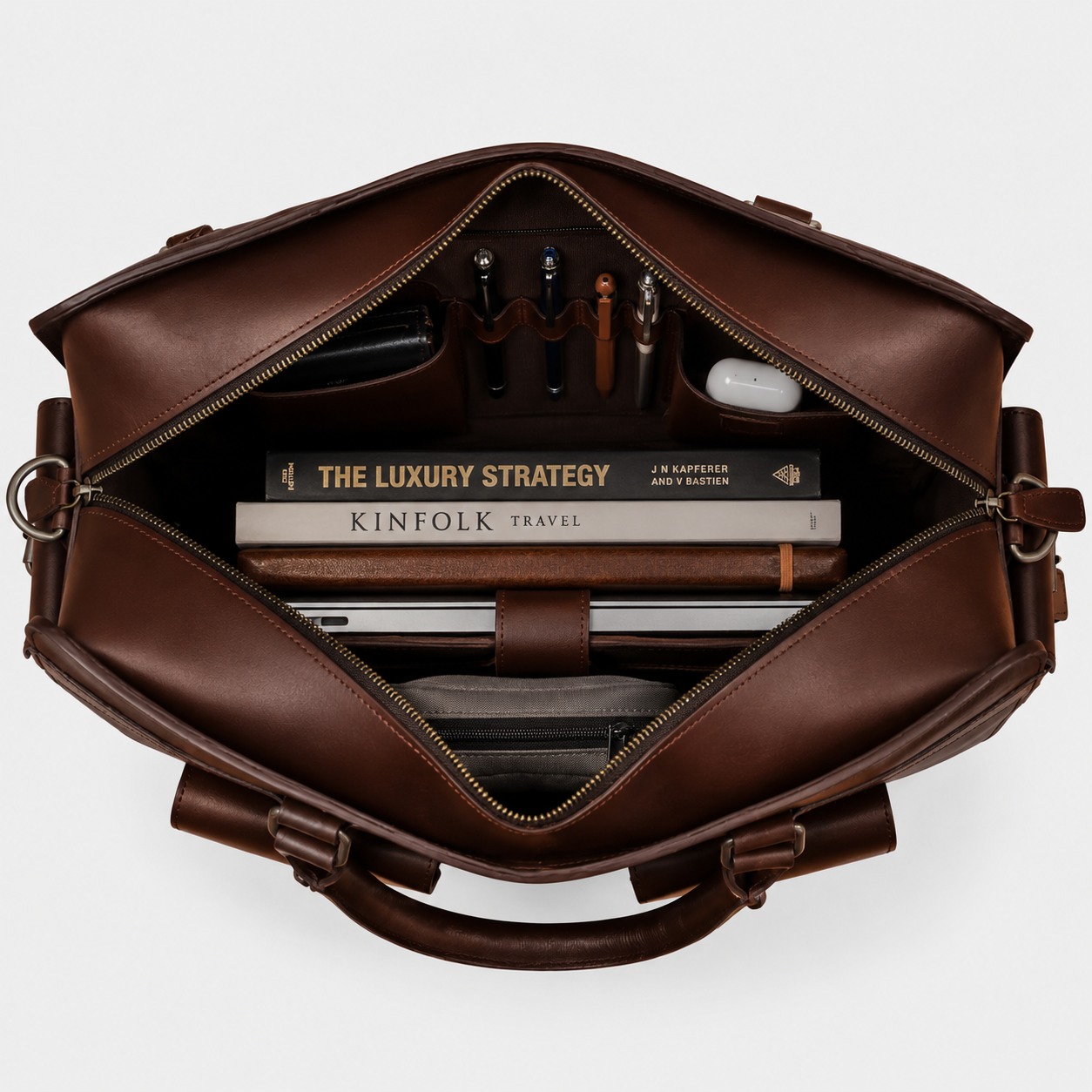Interior of The Bradford leather work bag showing padded laptop compartment and organizer pockets