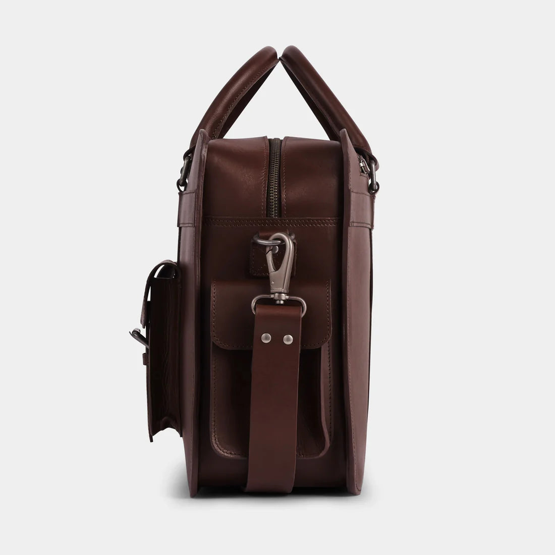 Side profile of handcrafted leather briefcase with reinforced handles