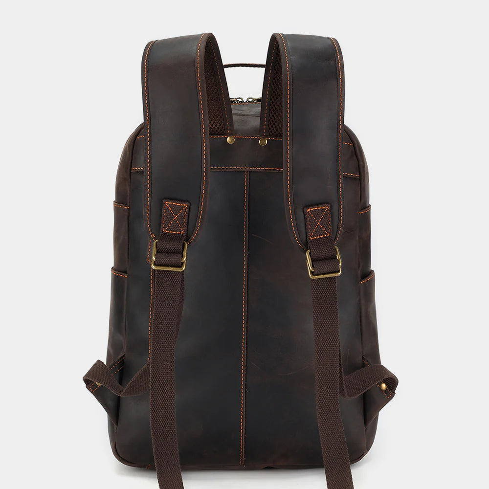 Rear view of leather backpack with padded shoulder straps and breathable back panel