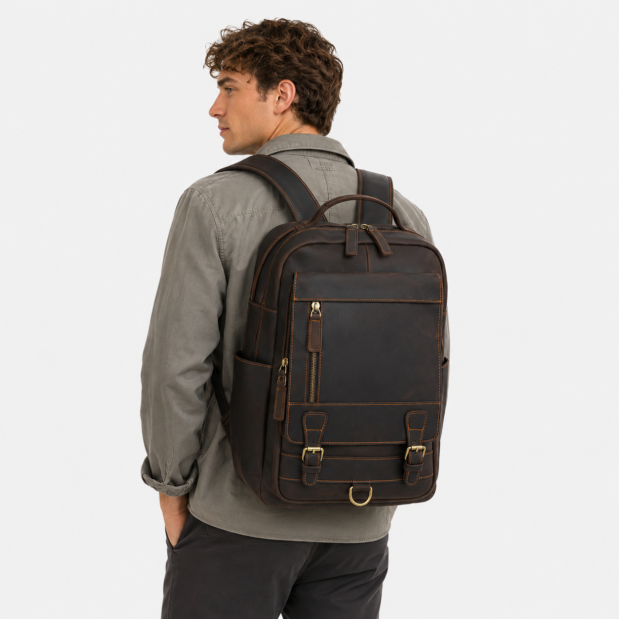 Professional carrying The District leather backpack during daily commute