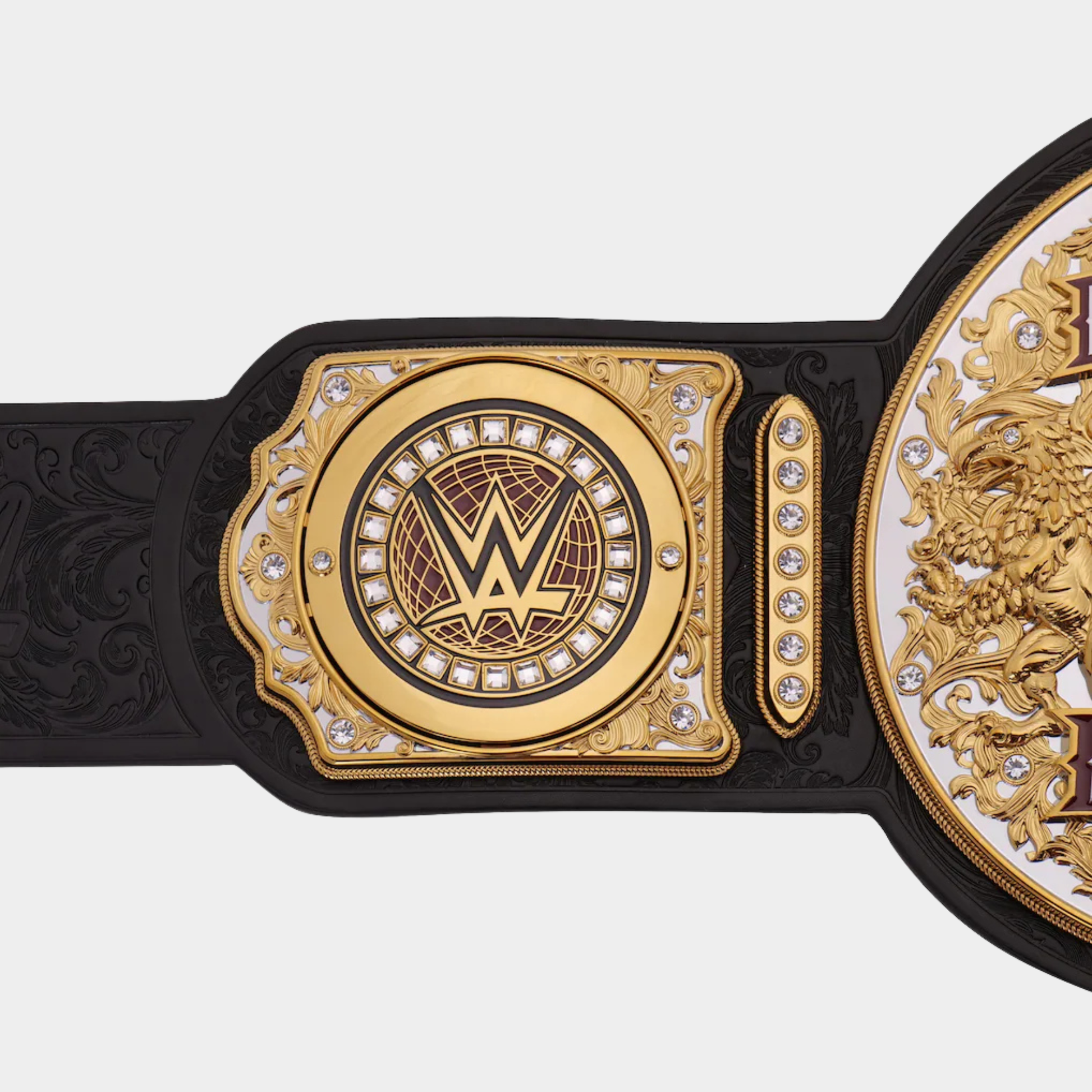 Detailed gold-plated center plate of The Dynasty Tag Team Championship collector belt