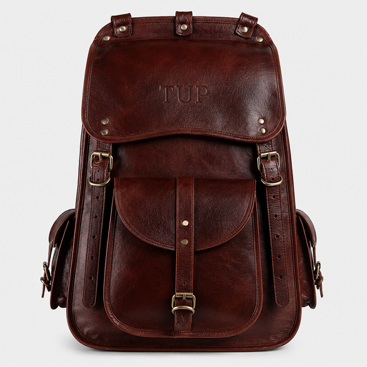 The Frontier full-grain buffalo leather backpack in vintage brown with buckle flap closure and brass hardware