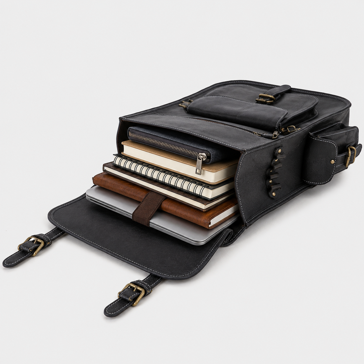 Travel essentials packed inside The Frontier leather backpack