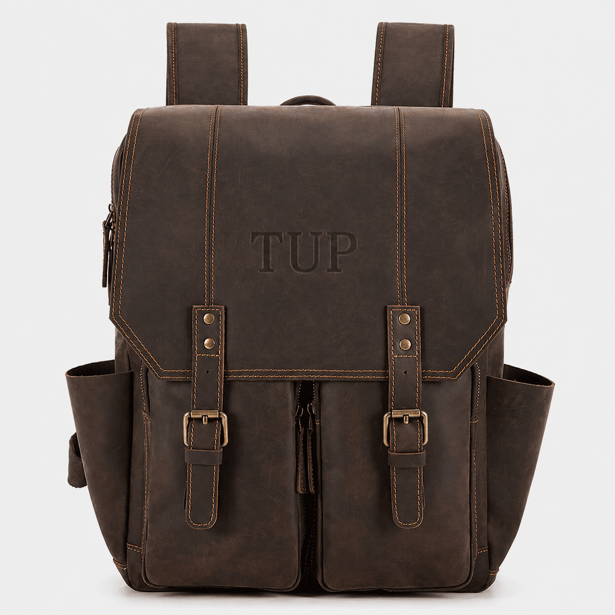 The Highland full grain leather backpack in vintage brown with dual buckle straps and premium brass hardware
