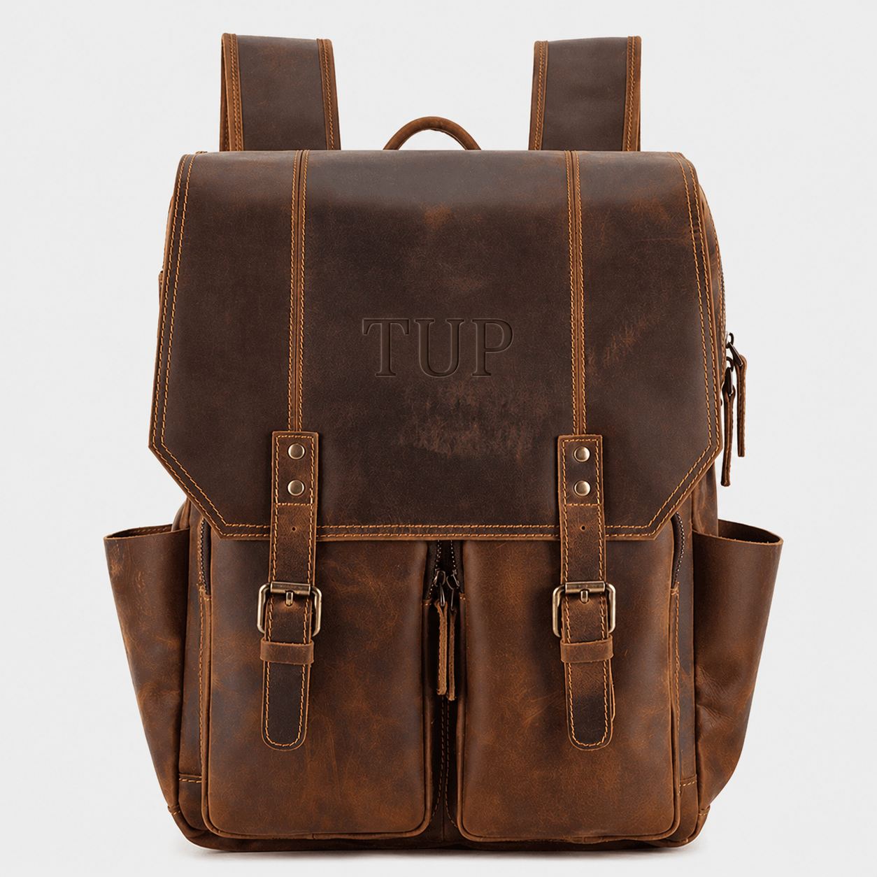 The Highland full grain leather backpack in vintage brown with dual buckle straps and premium brass hardware