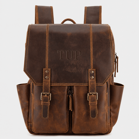 The Highland full grain leather backpack in vintage brown with dual buckle straps and premium brass hardware
