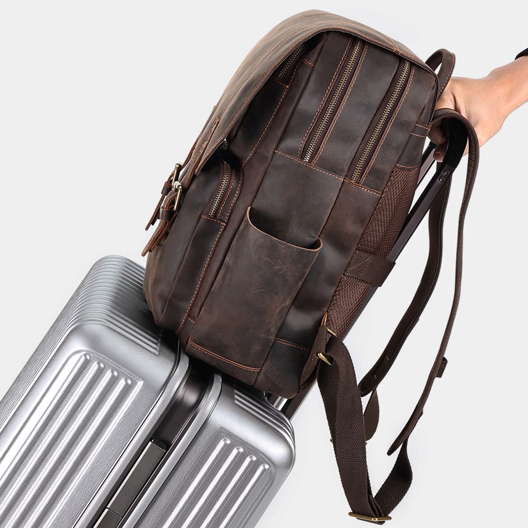 Rear view of handcrafted leather backpack with padded back panel and adjustable straps