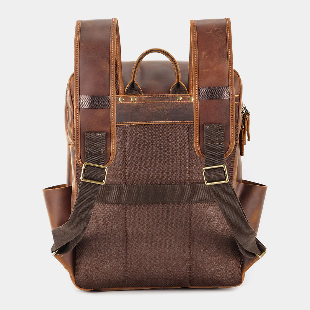 Rear view of handcrafted leather backpack with padded back panel and adjustable straps
