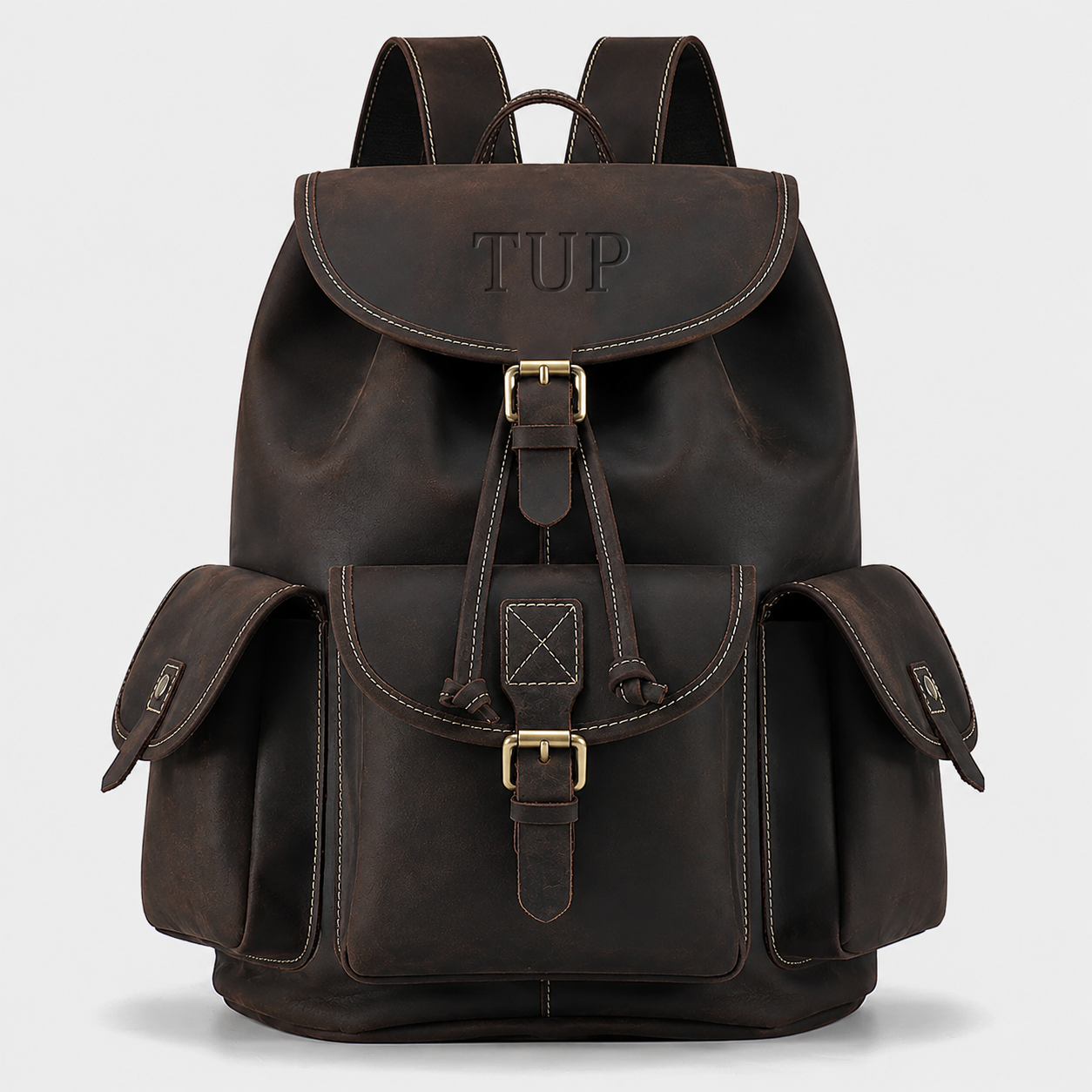 The Outlander top-grain leather backpack in dark brown with drawstring closure and buckle flap