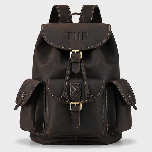 The Outlander top-grain leather backpack in dark brown with drawstring closure and buckle flap