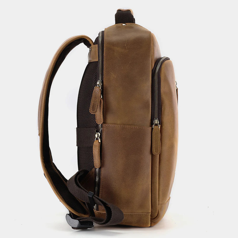 Side profile of The Sterling leather backpack showing slim business silhouette