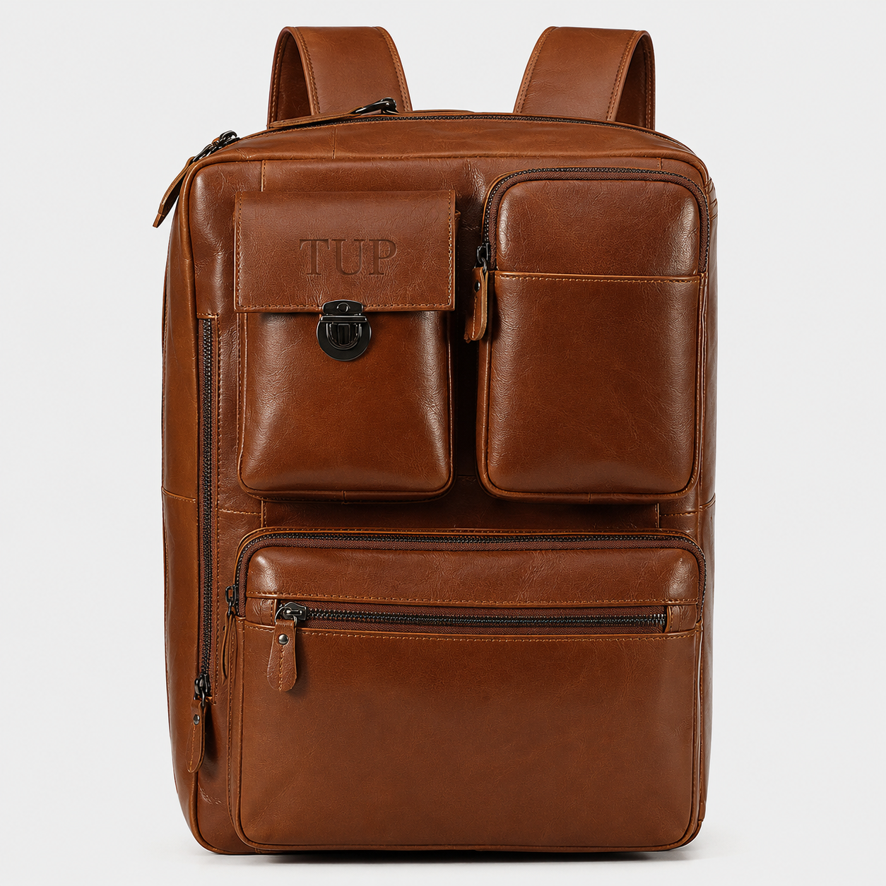 Brown leather convertible backpack with hidden shoulder straps and luggage sleeve