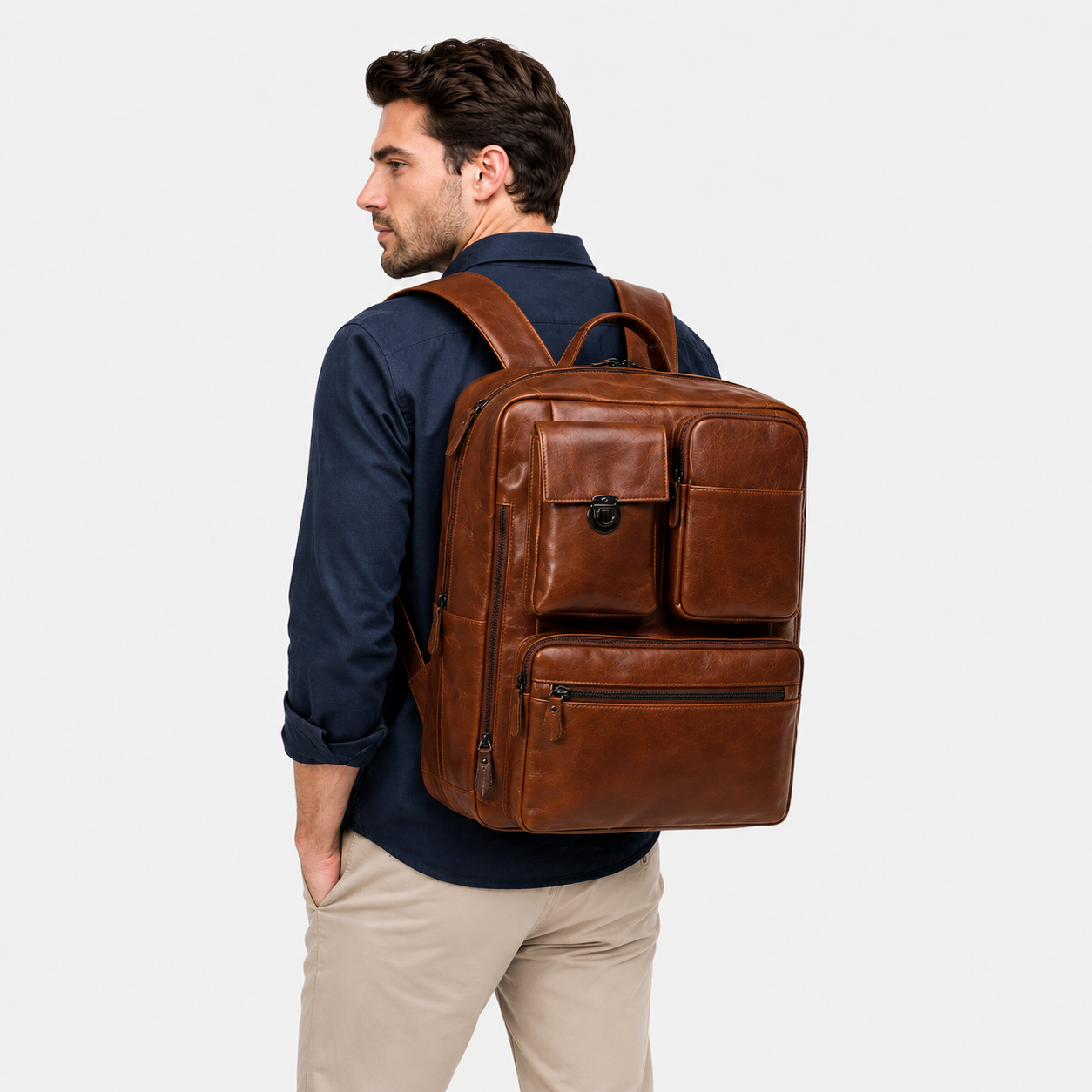 Professional carrying the Voyager Pro convertible leather backpack during business travel