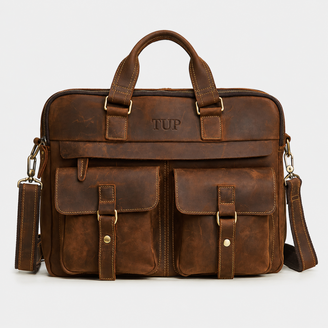 Premium brown leather messenger bag handcrafted from full-grain leather with multiple front pockets and adjustable shoulder strap.